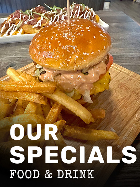 Image of delicious burger from Rivalry Alehouse, offering the best food and drink specials in Antioch Illinois