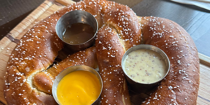 Bavarian pretzel with dipping sauces, appetizer from Rivalry Alehouse, the best restaurant in Antioch Illinois